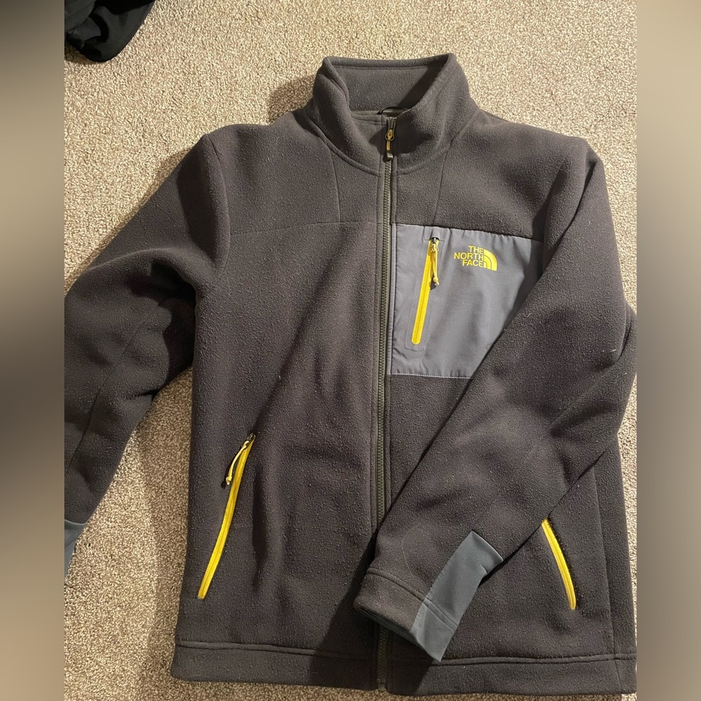 The North Face fleece zip up jacket, green with grey and yellow accents.